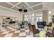 Clubhouse lounge with stylish seating, dining area, and abundant natural light at 5 Barbados Rd # 31, Englewood, FL 34223