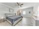 Stylish main bedroom with decorative wall and wood-look floors at 5 Barbados Rd # 31, Englewood, FL 34223