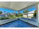 Enclosed patio with wooden floors and screen windows for enjoying the outdoors at 5 Barbados Rd # 31, Englewood, FL 34223