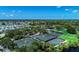 Aerial view of several outdoor tennis and pickleball courts in a community setting at 5 Barbados Rd # 31, Englewood, FL 34223