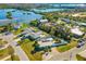 Ariel view of waterfront neighborhood that features a home with a pool and a canal in the back at 503 Roberts Bay Dr, Nokomis, FL 34275