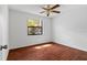 Bedroom featuring wood floors and a ceiling fan at 5084 Barrington Cir # 3202, Sarasota, FL 34234