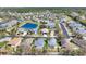 Aerial view of a residential area with multiple houses and ponds at 5234 Aqua Breeze Dr, Bradenton, FL 34208