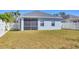 The backyard features a screened patio with vinyl fence surround at 5234 Aqua Breeze Dr, Bradenton, FL 34208