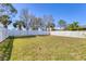 The backyard includes green grass and a white vinyl fence at 5234 Aqua Breeze Dr, Bradenton, FL 34208