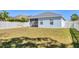 The backyard features a screened patio with vinyl fence surround at 5234 Aqua Breeze Dr, Bradenton, FL 34208