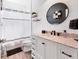 Bathroom with a white vanity, stylish shiplap walls, and modern fixtures at 5234 Aqua Breeze Dr, Bradenton, FL 34208