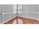Bedroom features hardwood floors, neutral paint, and natural light at 5234 Aqua Breeze Dr, Bradenton, FL 34208