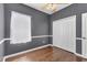 This bedroom features wood-look floors, a ceiling fan and closet at 5234 Aqua Breeze Dr, Bradenton, FL 34208