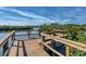 A wooden dock and observation deck offers serene water views surrounded by mangroves at 5234 Aqua Breeze Dr, Bradenton, FL 34208