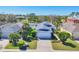 Charming single-story home with a well-manicured lawn and mature landscaping, complemented by a driveway and attached garage at 5234 Aqua Breeze Dr, Bradenton, FL 34208