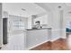 Bright kitchen features white cabinets, granite countertops, and a breakfast bar at 5234 Aqua Breeze Dr, Bradenton, FL 34208