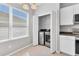 Well-lit laundry area equipped with modern washer and dryer units, ample storage, and a window for ventilation at 5234 Aqua Breeze Dr, Bradenton, FL 34208