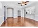 Spacious living room with hardwood floors and an arched entryway to the kitchen at 5234 Aqua Breeze Dr, Bradenton, FL 34208