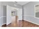 Home office with hardwood floors and double doors leading to the living room at 5234 Aqua Breeze Dr, Bradenton, FL 34208