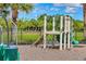 A toddler-friendly playground with a small slide and climbing features provides fun for  at 5234 Aqua Breeze Dr, Bradenton, FL 34208