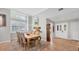Bright dining room featuring a large window, modern lighting, and neutral paint at 5655 Pipers Waite # 27, Sarasota, FL 34235