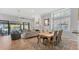 Bright living room featuring tile floors, a fireplace, and sliding glass doors at 5655 Pipers Waite # 27, Sarasota, FL 34235