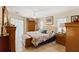 Spacious main bedroom with tile floors, fan, and natural light from the sliding glass door at 5747 29Th E St, Bradenton, FL 34203