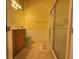 Bathroom with a single sink vanity and enclosed shower at 5962 Roseto Pl, Sarasota, FL 34238