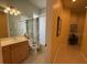 Bathroom featuring a vanity with a sink, mirror and combined shower and tub at 5962 Roseto Pl, Sarasota, FL 34238