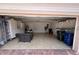 Spacious two-car garage with ample storage space, ideal for organizing tools and equipment at 5962 Roseto Pl, Sarasota, FL 34238