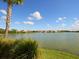 Scenic lake view showcases waterfront homes and natural beauty for an idyllic community setting at 5962 Roseto Pl, Sarasota, FL 34238