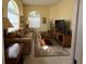 Cozy living room featuring a comfortable couch and natural light from the windows at 5962 Roseto Pl, Sarasota, FL 34238