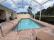 Inviting screened-in pool with poolside chairs and lush landscaping, perfect for relaxation at 5962 Roseto Pl, Sarasota, FL 34238