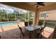 Relaxing screened-in pool with outdoor dining table, a great space for entertaining and soaking up the sun at 5962 Roseto Pl, Sarasota, FL 34238