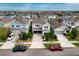 Aerial view of a charming home nestled in a well-planned community with landscaped streets at 6136 Voyagers Pl, Apollo Beach, FL 33572