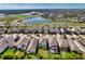 A high angle aerial view of the neighborhood and its many well-kept homes and landscaping features at 6136 Voyagers Pl, Apollo Beach, FL 33572