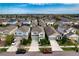An aerial view of a residential area of homes with manicured lawns and paved driveways at 6136 Voyagers Pl, Apollo Beach, FL 33572