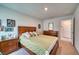 Comfortable bedroom featuring a queen bed, matching nightstands, and neutral decor at 6136 Voyagers Pl, Apollo Beach, FL 33572