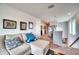Open hallway with a comfortable couch and decor at 6136 Voyagers Pl, Apollo Beach, FL 33572