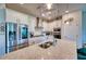 Gourmet kitchen featuring stainless steel appliances, granite countertops, and custom white cabinetry at 6136 Voyagers Pl, Apollo Beach, FL 33572