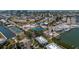 Panoramic aerial view of a residential area with tennis courts and boat access at 6200 Flotilla Dr # 245, Holmes Beach, FL 34217