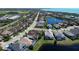 Overhead view of the neighborhood with lush landscaping, serene lakes, and community amenities at 6208 Signature Pointe Ln, Bradenton, FL 34210