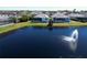 Aerial view of homes backing up to a pond with water feature at 6208 Signature Pointe Ln, Bradenton, FL 34210