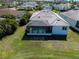 An angled view of the home's backyard and screened-in pool at 6208 Signature Pointe Ln, Bradenton, FL 34210