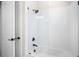 Clean bathroom with white tiled tub and black fixtures at 6208 Signature Pointe Ln, Bradenton, FL 34210