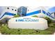 Welcoming IMG Academy campus sign with modern architecture and lush greenery, showcasing a premier institution at 6208 Signature Pointe Ln, Bradenton, FL 34210