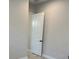 Bedroom doorway with neutral walls and tile flooring at 6208 Signature Pointe Ln, Bradenton, FL 34210