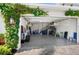 This two-car garage features an epoxy floor, stairs to upper storage, and a well-lit space at 6208 Signature Pointe Ln, Bradenton, FL 34210