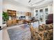 Spacious home office with ample desk space, natural light, and stylish decor at 6208 Signature Pointe Ln, Bradenton, FL 34210
