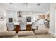Open kitchen with large island, breakfast bar seating, stainless steel appliances, and custom cabinetry at 6208 Signature Pointe Ln, Bradenton, FL 34210