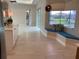 Bright sitting area featuring tile floors, a comfortable bench and large bright windows at 6208 Signature Pointe Ln, Bradenton, FL 34210