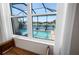 View of the screened pool area from inside a bright, well-lit home at 6208 Signature Pointe Ln, Bradenton, FL 34210