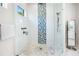 Modern glass shower with decorative tile and matte black fixtures at 6208 Signature Pointe Ln, Bradenton, FL 34210