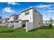 Exterior view of a townhome with a private fenced backyard and lush green grass at 6265 Fairmont Ln, Palmetto, FL 34221